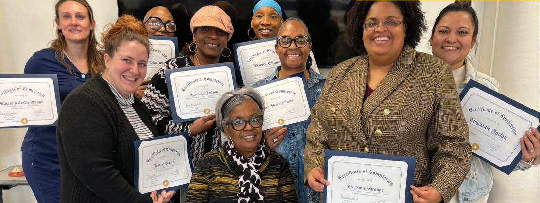 women sitting at round tables talking